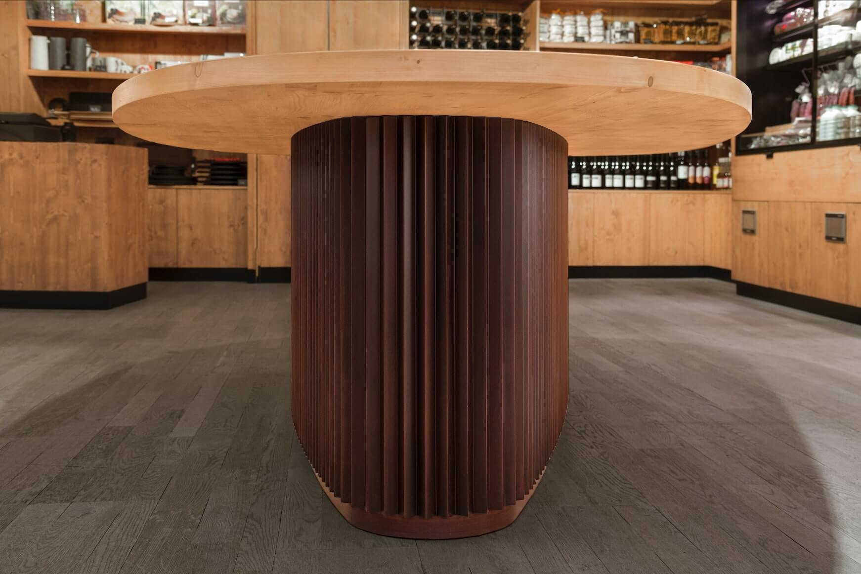 the furniture of the wood table has an oval shape