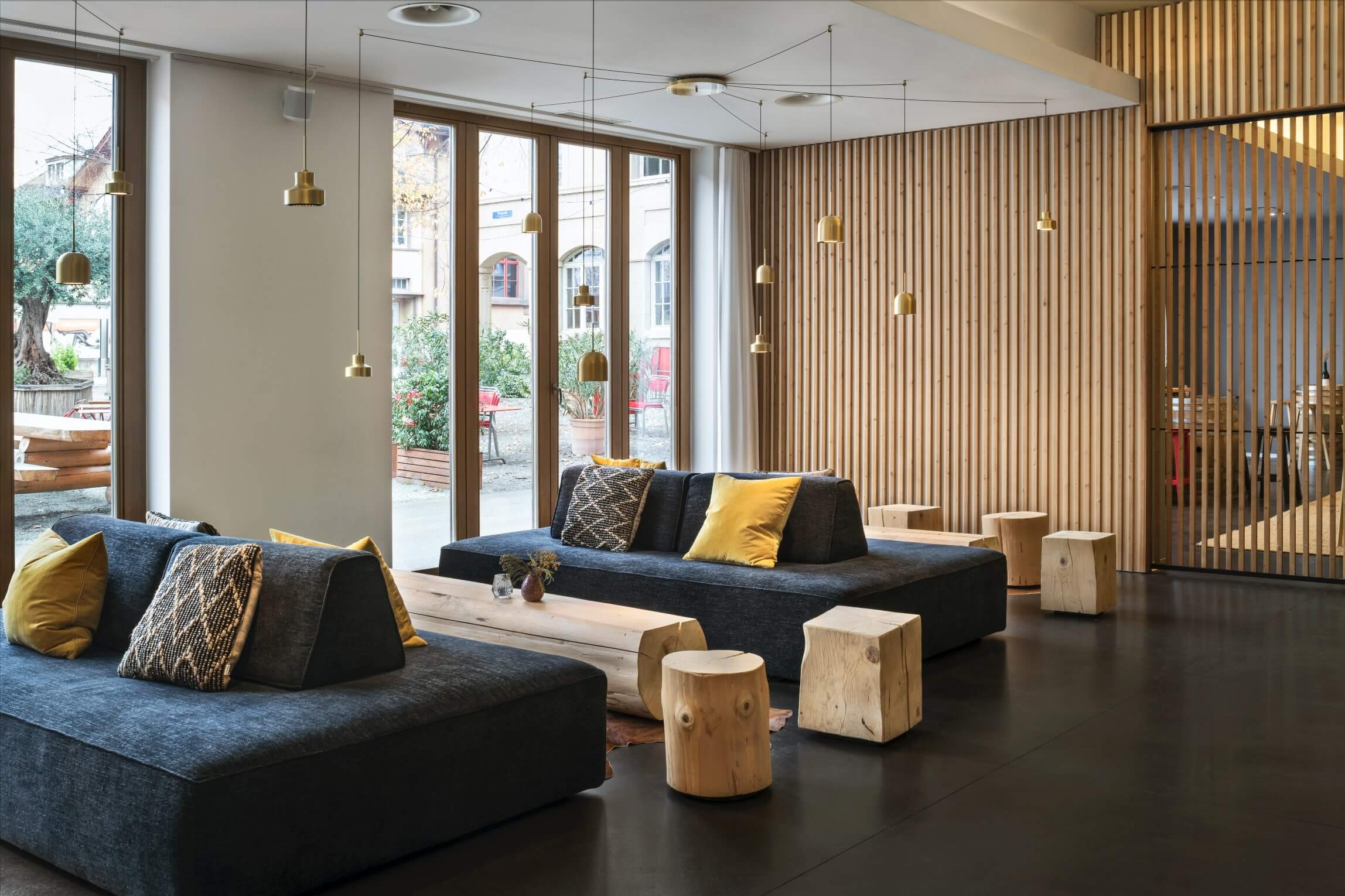 the lobby of the hotel has a nordic design which integrates wood